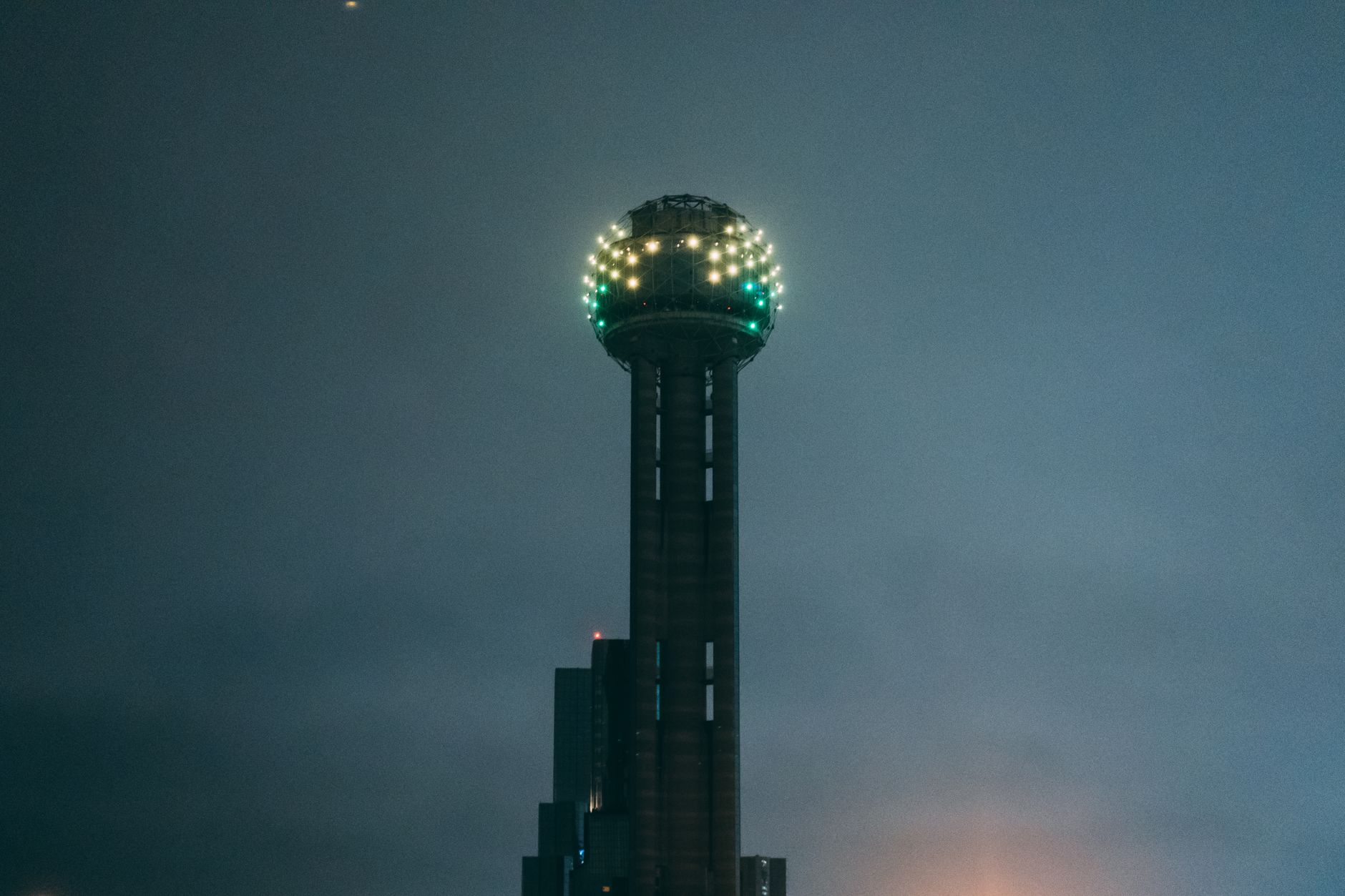 Reunion Tower lit at night in Dallas